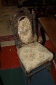 A set of four gilt decorated carved oak dining chairs There is no condition report available on this