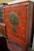 A Chinese red lacquered drinks cabinet 178cm high, 108cm wide