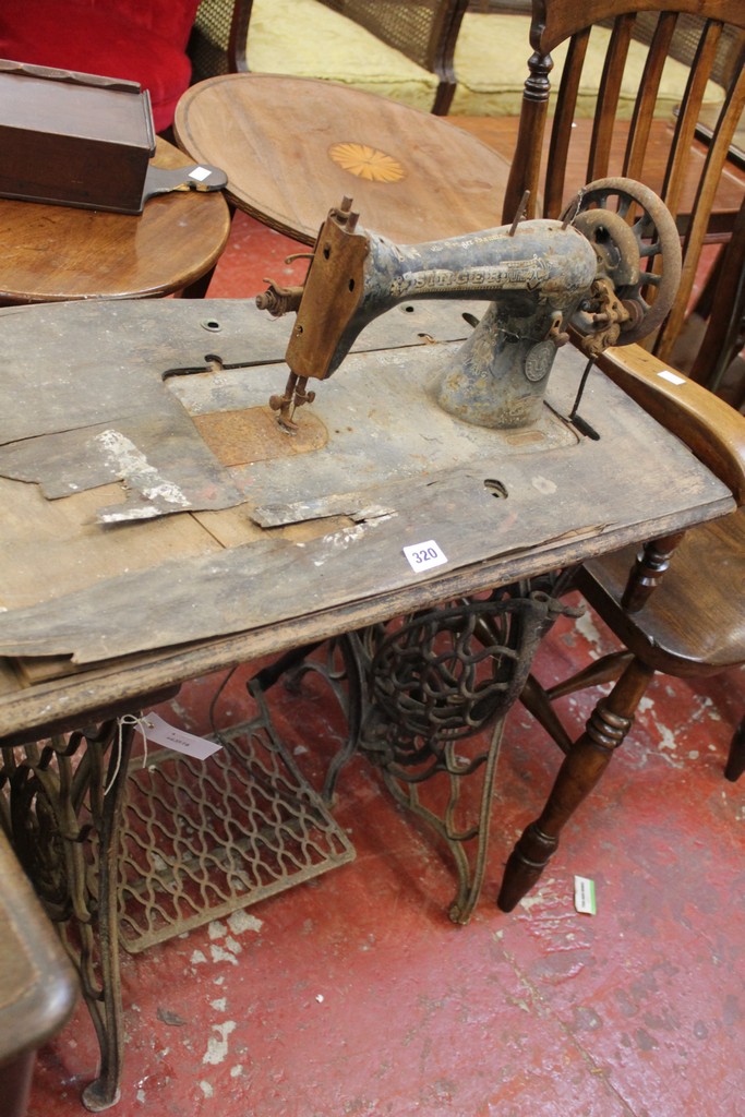 A Victorian treadle base Singer sewing machine There is no condition report available on this lot