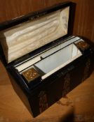 A stationery casket with chased brass work and a leather fitted interior. There is no condition