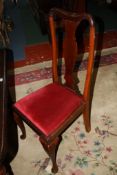 A set of eight matched mahogany Queen Anne style dining chairs