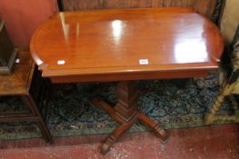 A mahogany card table with a shaped column and four angled feet 84cm wide There is no condition