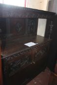 A 19th century Jacobean style oak court cupboard with carved back and doors, 145cm wide There is