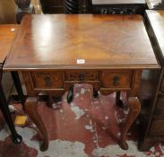 An 18th Century style walnut lowboy with three drawers on cabriole legs 69cm wide There is no