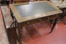 A Victorian oak two drawer writing table 104cm wide