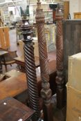 A pair of carved mahogany standard lamps, and another (3) (sold as parts)