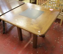 An oak and slate inset square table on chamfered legs 75cm high, 99cm wide