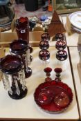A pair of Victorian cranberry glass lustres, two cranberry glass vases, six wine glasses, and