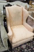 A wing armchair and a 17th century style armchair (2) There is no condition report available on this
