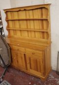 A 20th century pine dresser 166cm high, 137cm wide There is no condition report available on this