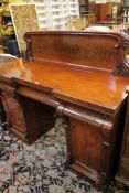 A 19th Century mahogany pedestal sideboard, with leaf carved superstructure, pair of panelled