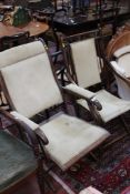 A late Victorian mahogany folding chair and another There is no condition report available on this