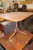 A 19th Century mahogany occasional table with turned column and tripod feet and block feet There