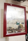 A Nina Campbell red crocodile mirror with a bevelled plate 92cm high, 71cm wide