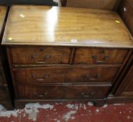 A George III mahogany chest of drawers with brushing slide above four long drawers, bracket feet,