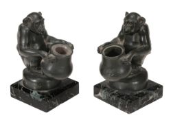 Max Le Verrier, pair of green patinated spelter inkwells of chimpanzees on variegated marble bases