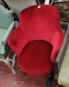 A red tub shaped dressing room chair. There is no condition report available on this lot.