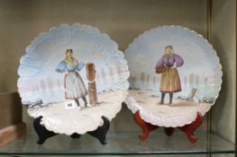 A pair of 19th century French Chargers, Limoges decorated with Fishwomen from Les Sable D`Olonne