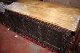 A Charles II panelled oak chest, circa 1660, probably Lancashire, the hinged top above a triple