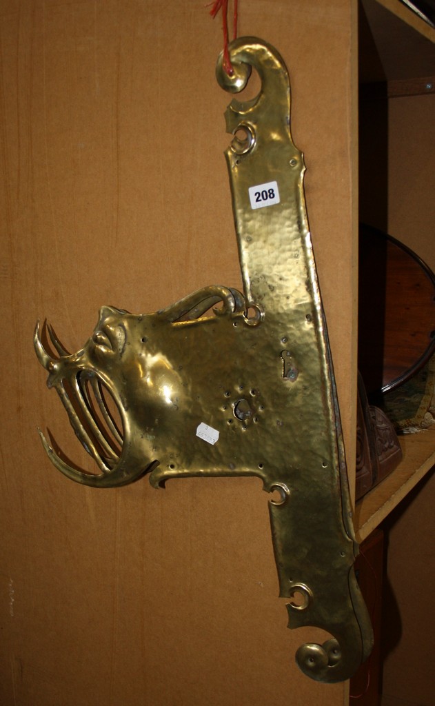 A pair of beaten brass door plates in the Pugin style. There is no condition report available on