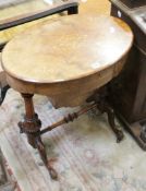 A Victorian walnut and inlaid oval work table 63cm wide