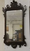 A George II style mahogany fret carved mirror 110cm high, 60cm wide, an oyster veneered mirror & a