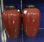 * Two Chinese sang de boeuf vases and covers.27cm high.