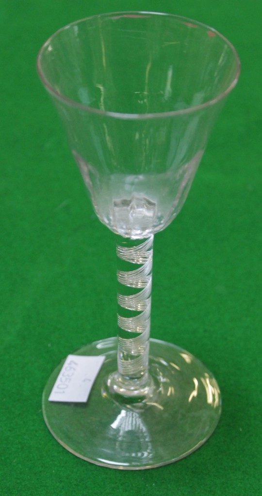 A multi-spiral airtwist stem wine glass, the round funnel bowl with a fluted lower section