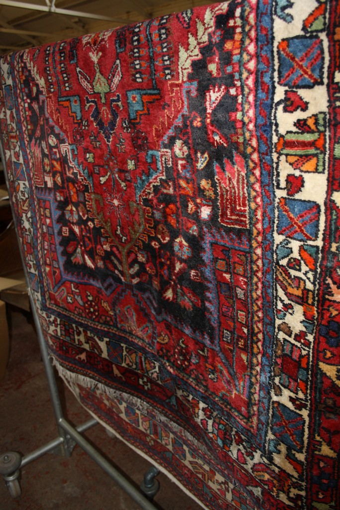 A Middle Eastern rug 137 x 217cm There is no condition report available on this lot.