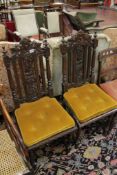 A pair of late Victorian carved oak chairs There is no condition report available on this lot.Best