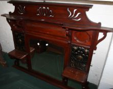 An early 20th Century Art Nouveau design mahogany overmantle 114cm high, 138cm wide