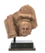 A red mottled sandstone fragment  of a Bodhisattva, North India, Mathura, Kushan Period, 2nd