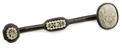 A jade mounted ruyi sceptre composed of pale celadon jade plaques carved with leaves designs,