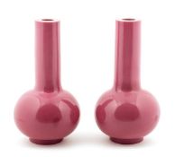 A pair of Peking glass bottle vases, 18th century, of opaque pink colour, bearing globular body,