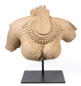 A monumental carved sandstone torso of a Devi, North India, Madhya Pradesh or Rajasthan, 11th-12th