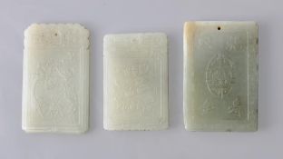Three pale celadon jade plaques of rectangular shape carved, respectively, with an immortal figure,