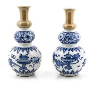 A pair of porcelain triple gourd vases, Kangxi period, with a slightly spreading foot and flared