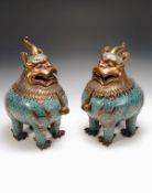 A rare pair of large cloisonne mythical beast covered censers, 18th-19th century, each plump beast