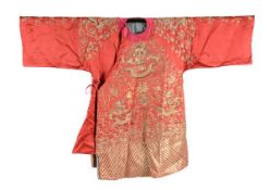 An embroidered red silk satin Han Chinese woman?s jacket, mangao, 19th century, worn by the wife of