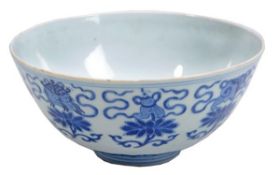A blue and white bowl, the steep sided bowl resting on a short, cylindrical foot and decorated to