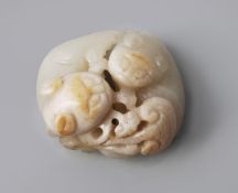 A jade group of two cats, coiled about each other, 18th century, with small ears and curling tails,