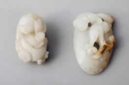 A small jade carving of Liu Hai, wearing loosely draped robes, holding the string of cash to tempt