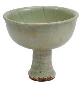 A Longquan celadon stem cup, Yuan dynasty, the ribbed, slightly splayed stem supporting a U-shaped