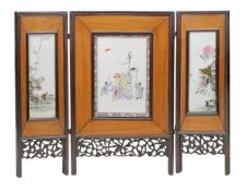 A Chinese hardwood porcelain mounted tripartite screen, 19th century, the central rectangular