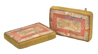 A Pair of Tibetan elbow cushions, 18th century and later, each of rectangular form, the tops made
