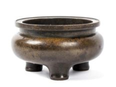 A bronze censer, early Qing dynasty, with compressed, globular walls,  the base cast with Xuande