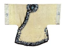 A cream silk patterned damask lady?s informal jacket, late 19th-early 20th century, edged with blue