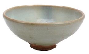 A Jun bowl, Yuan dynasty, the widely rounded sides with slightly inverted rim and resting on a
