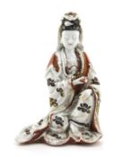A Chinese Blanc de Chine figure of Guanyin, 17th century, seated, with the left hand resting on the