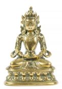 A Sino-Tibetan copper alloy or brass figure of Amitayus, 18th-19th century, seated in dhyanasana on